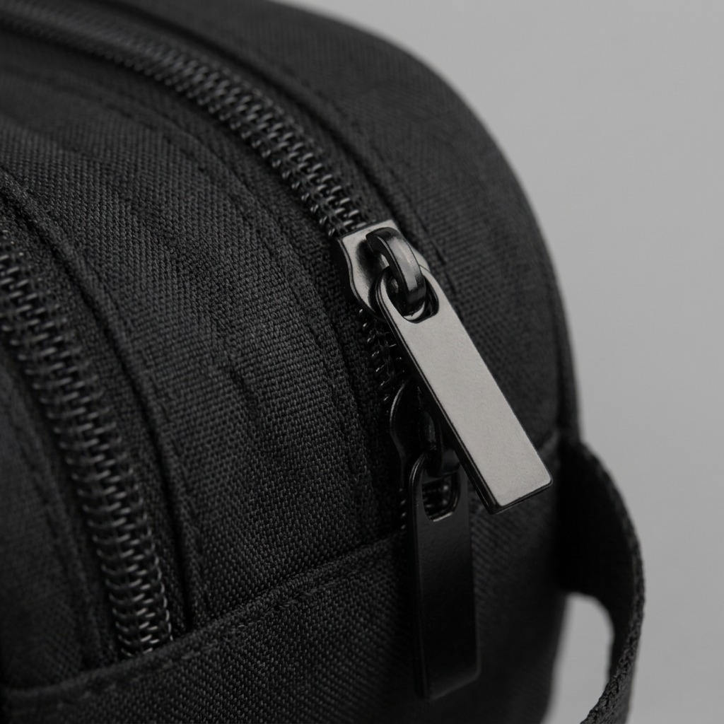 Close-up of the black zipper hardware and textured fabric on the Bugatti Bond Street Pencil Case.