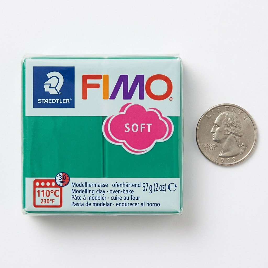A high-resolution product photograph of the 57g FIMO Soft Emerald modeling clay in its original clear plastic packaging.