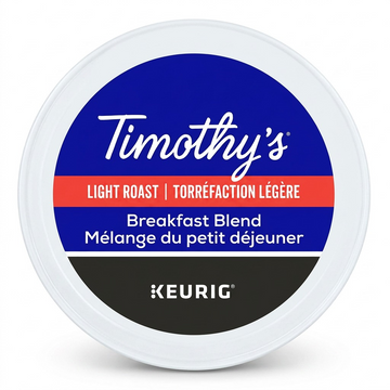 Pure high-resolution hero shot of a single Timothy's Breakfast Blend K-Cup, exactly as referenced in image_0.png, centrally positioned on a pure white background with a subtle, soft shadow, suitable for a Shopify product page. All label details, colors, and the Keurig logo are sharp and clear.