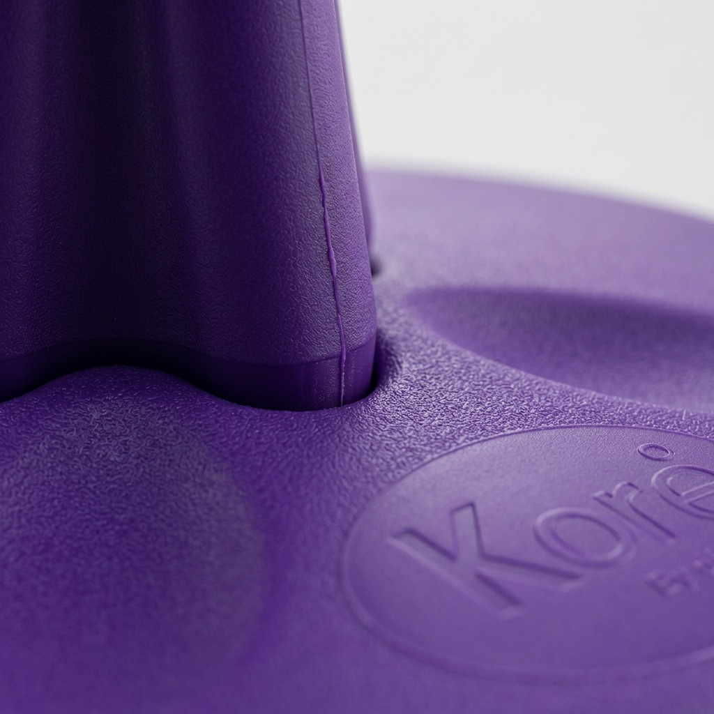 Macro detail of the purple Kore Toddler Wobble Stool showing the textured antimicrobial plastic.
