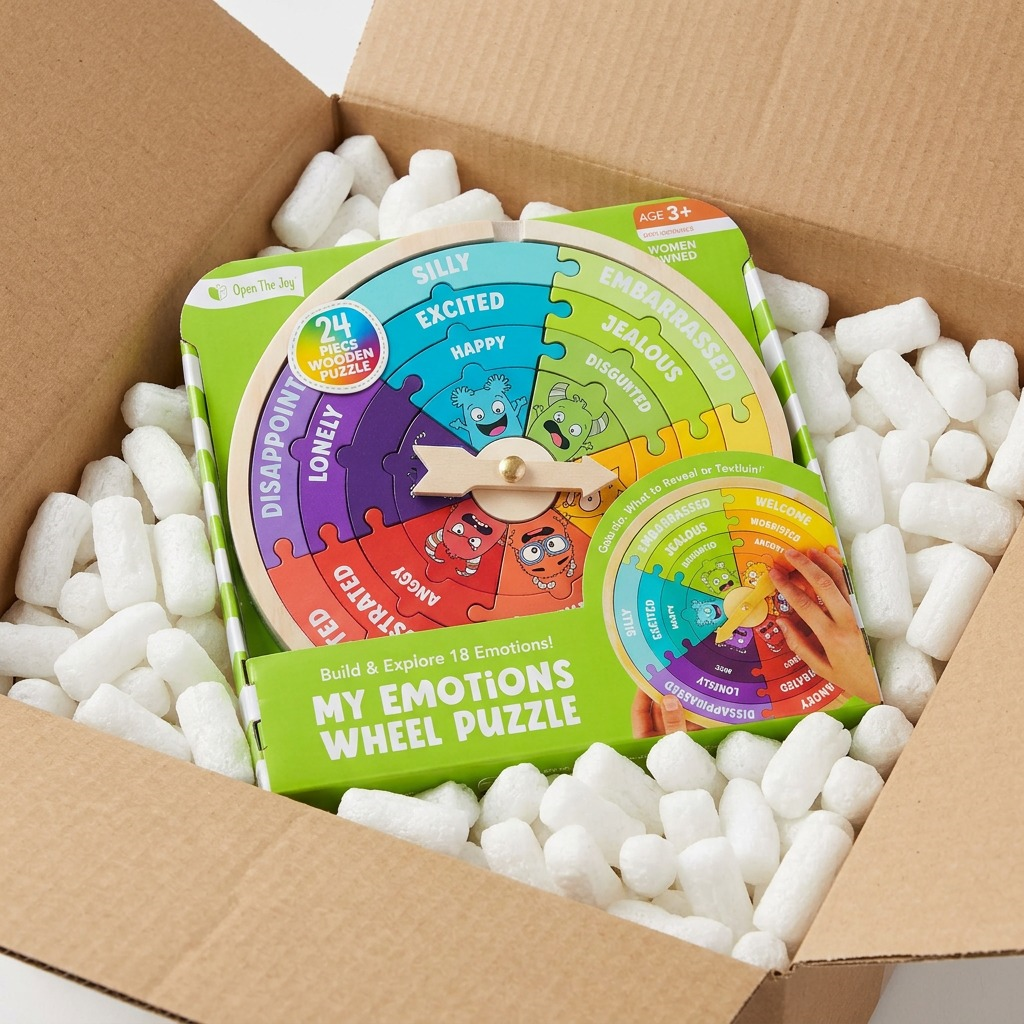 Unboxing photograph: 'My Emotions Wheel Puzzle' box safe in cargo box with protective foam peanuts.