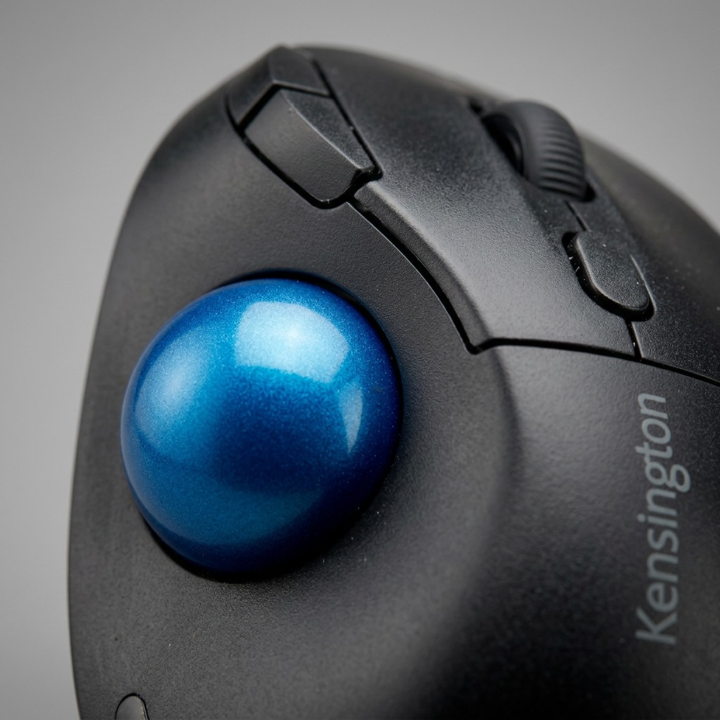 Macro close-up of the Kensington Pro Fit Ergo TB450 Trackball highlighting the blue metallic ball.