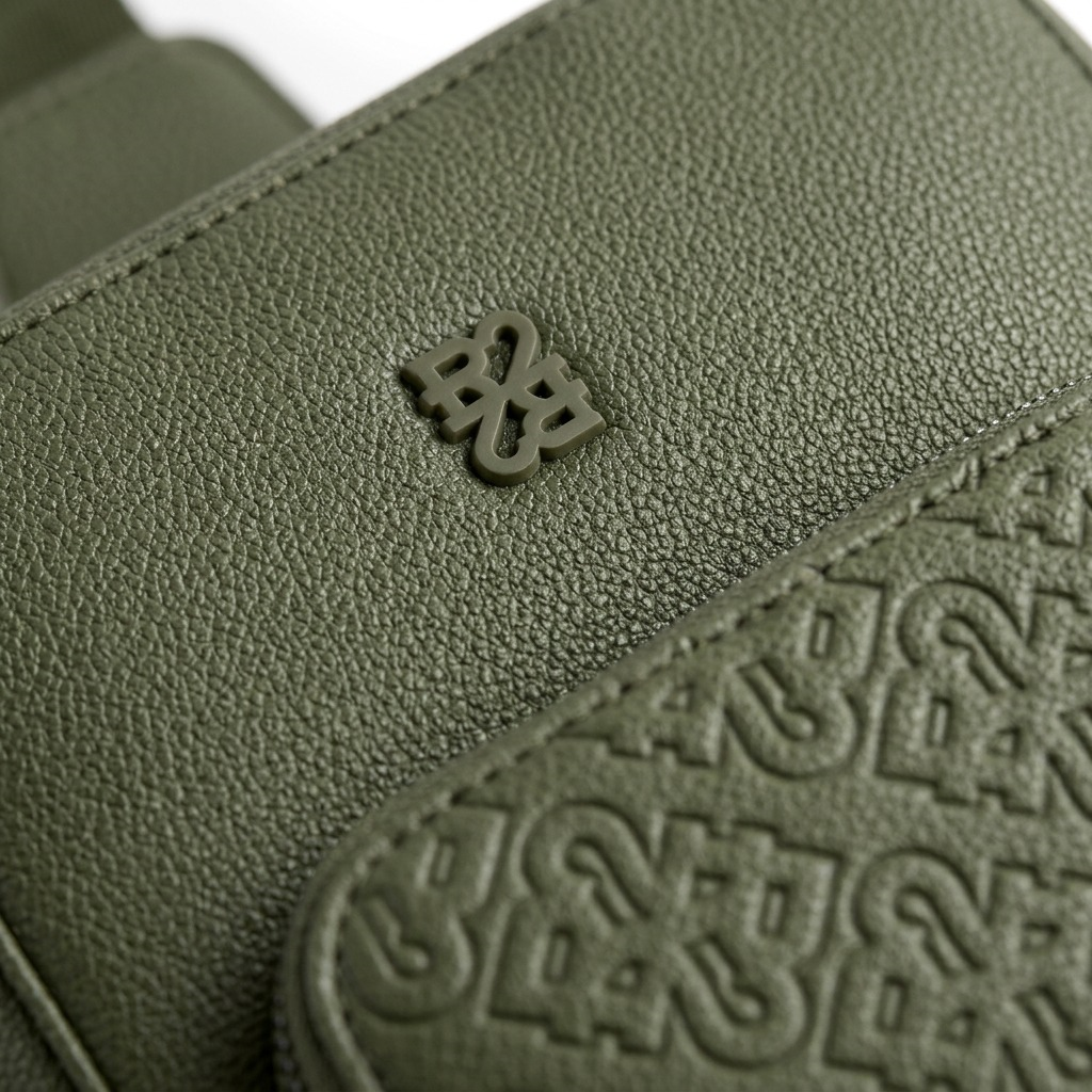 Bugatti Rick Ross sling bag in textured khaki green, centered with logos against a plain white background.